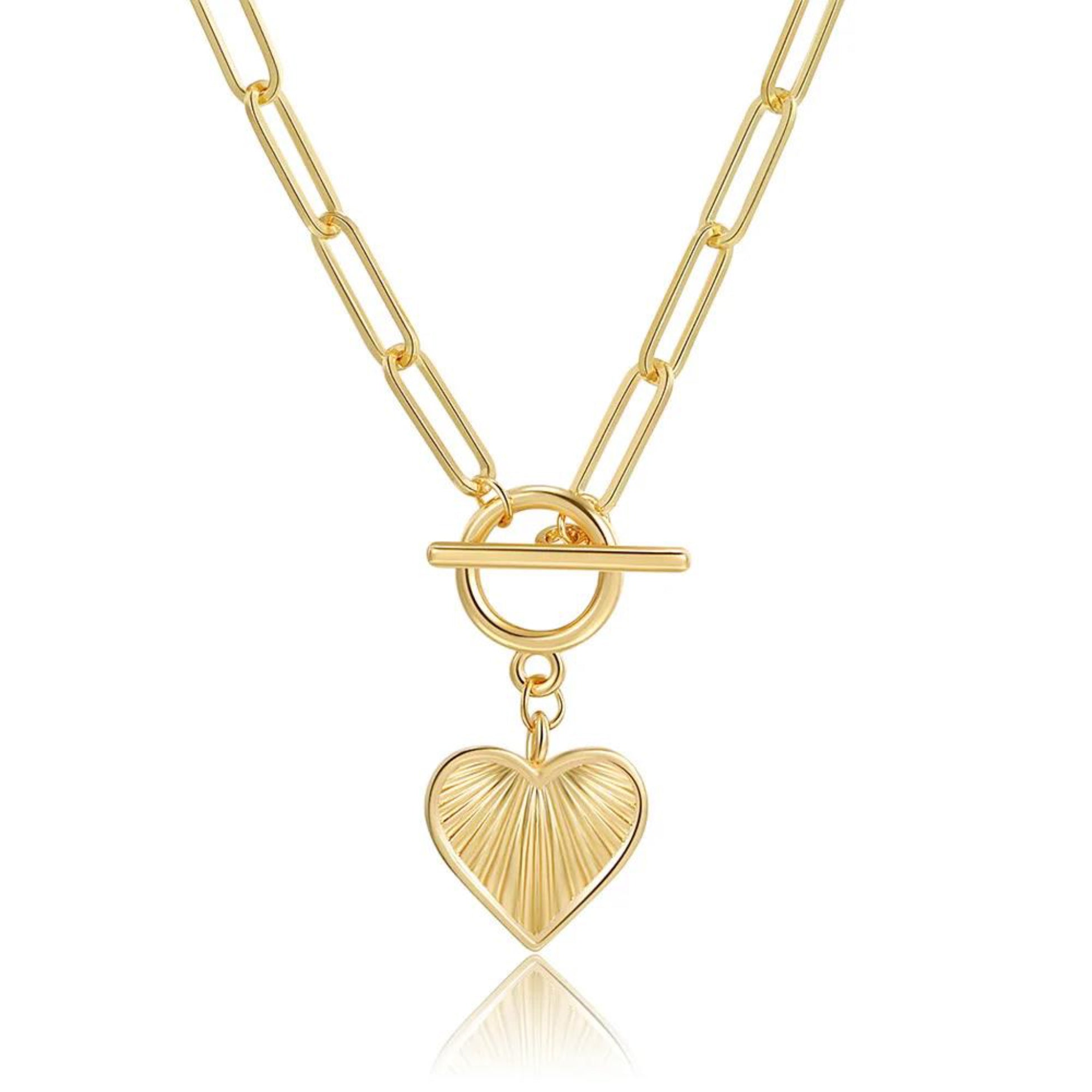 Gold necklace with a heart pendant on a white background