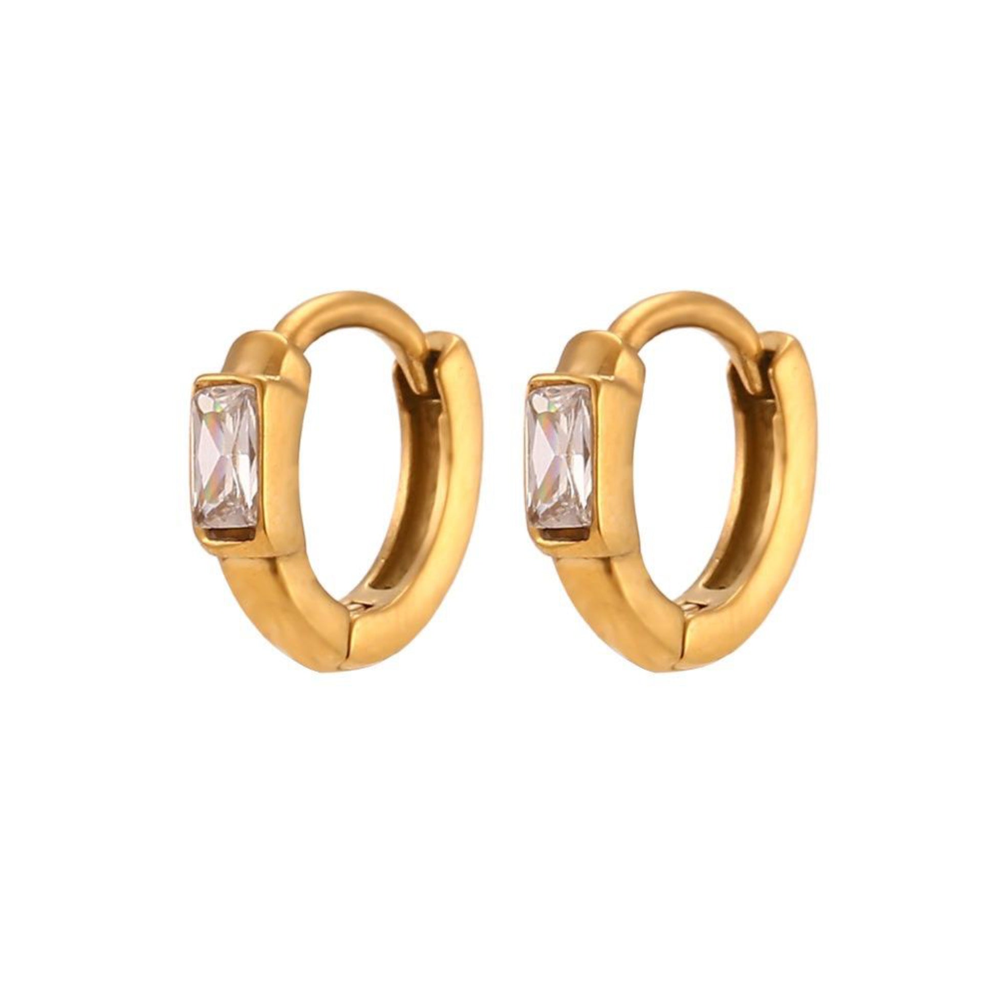 Gold hoop earrings with clear gemstones on a white background