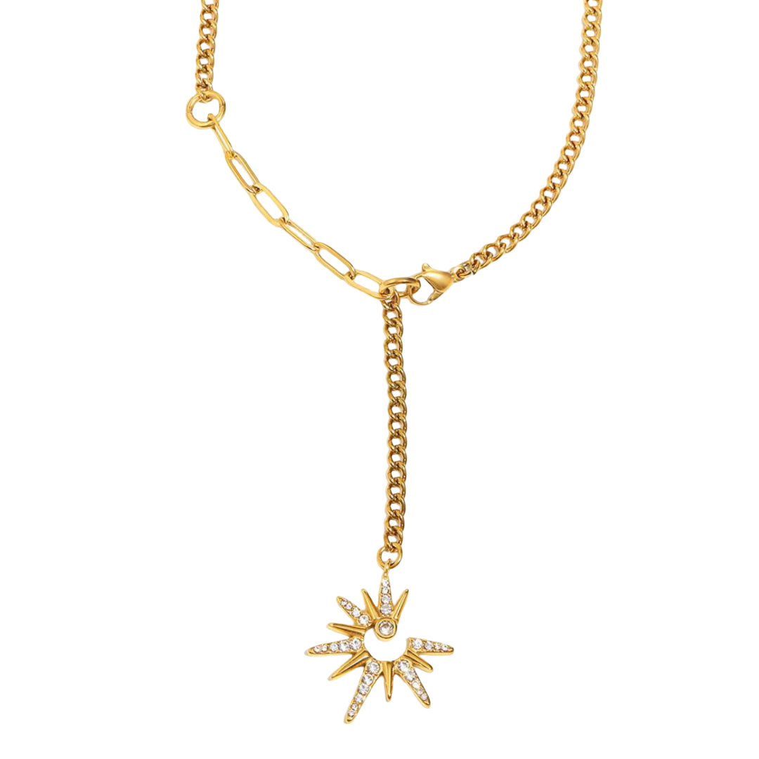 Gold necklace with a star-shaped pendant on a white background