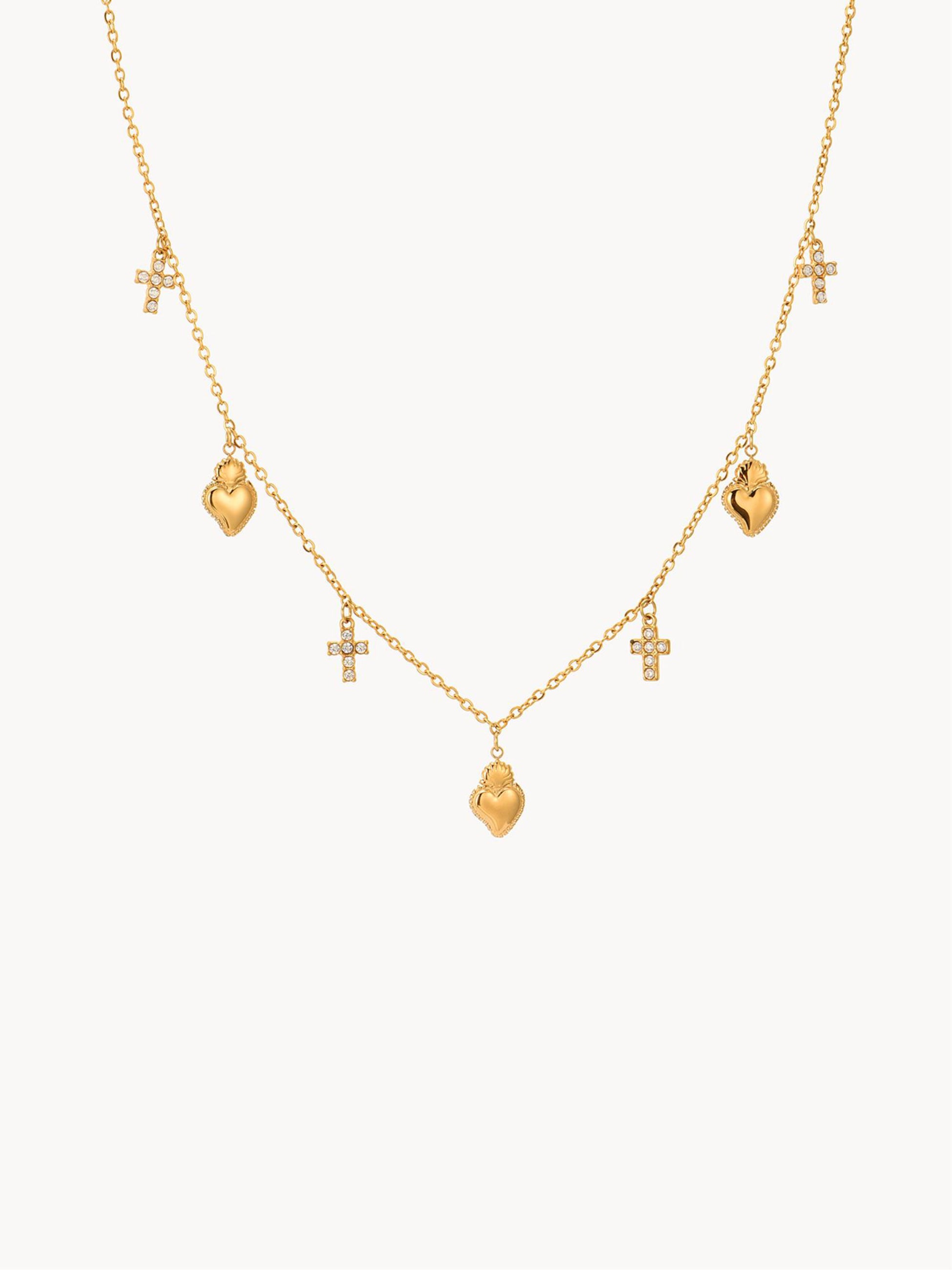 Gold necklace with heart and cross charms on a white background