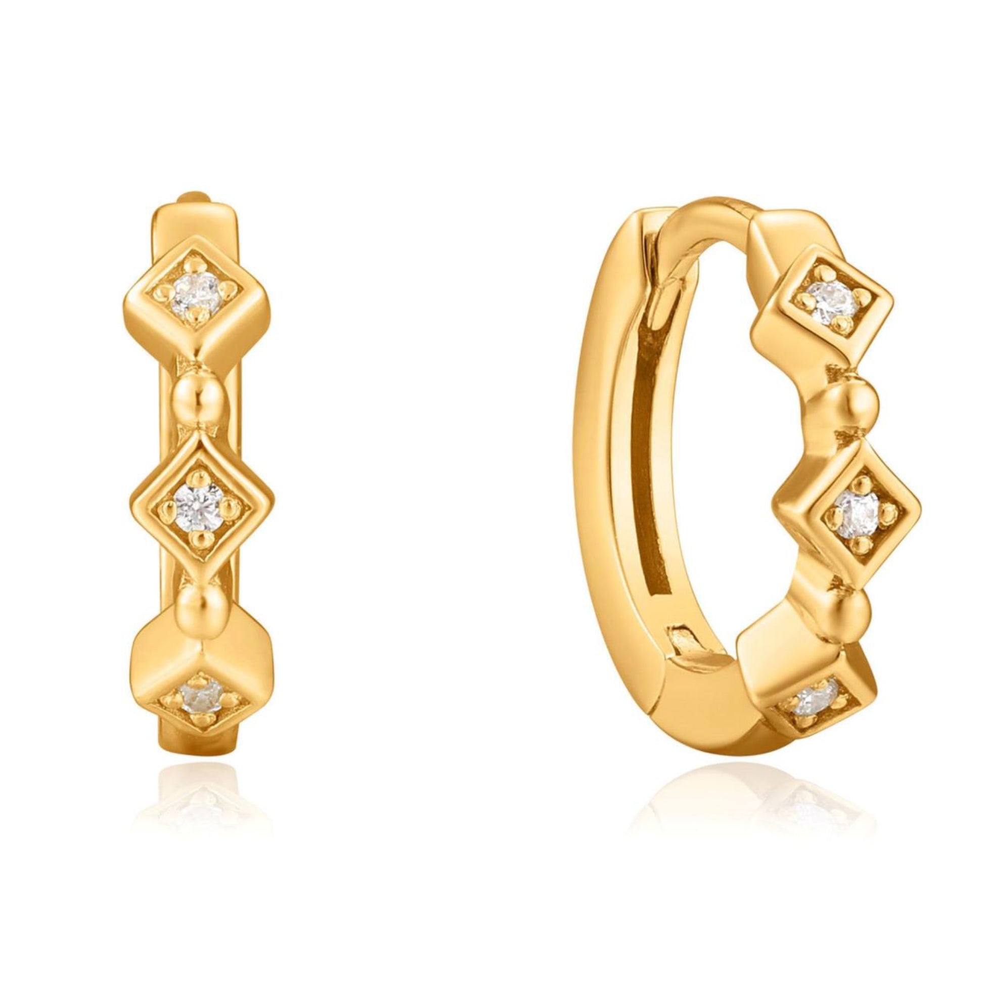 Gold hoop earrings with diamond accents on a white background
