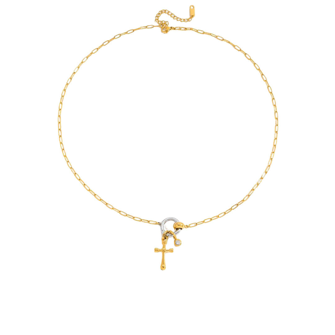 Gold necklace with a cross pendant on a white background