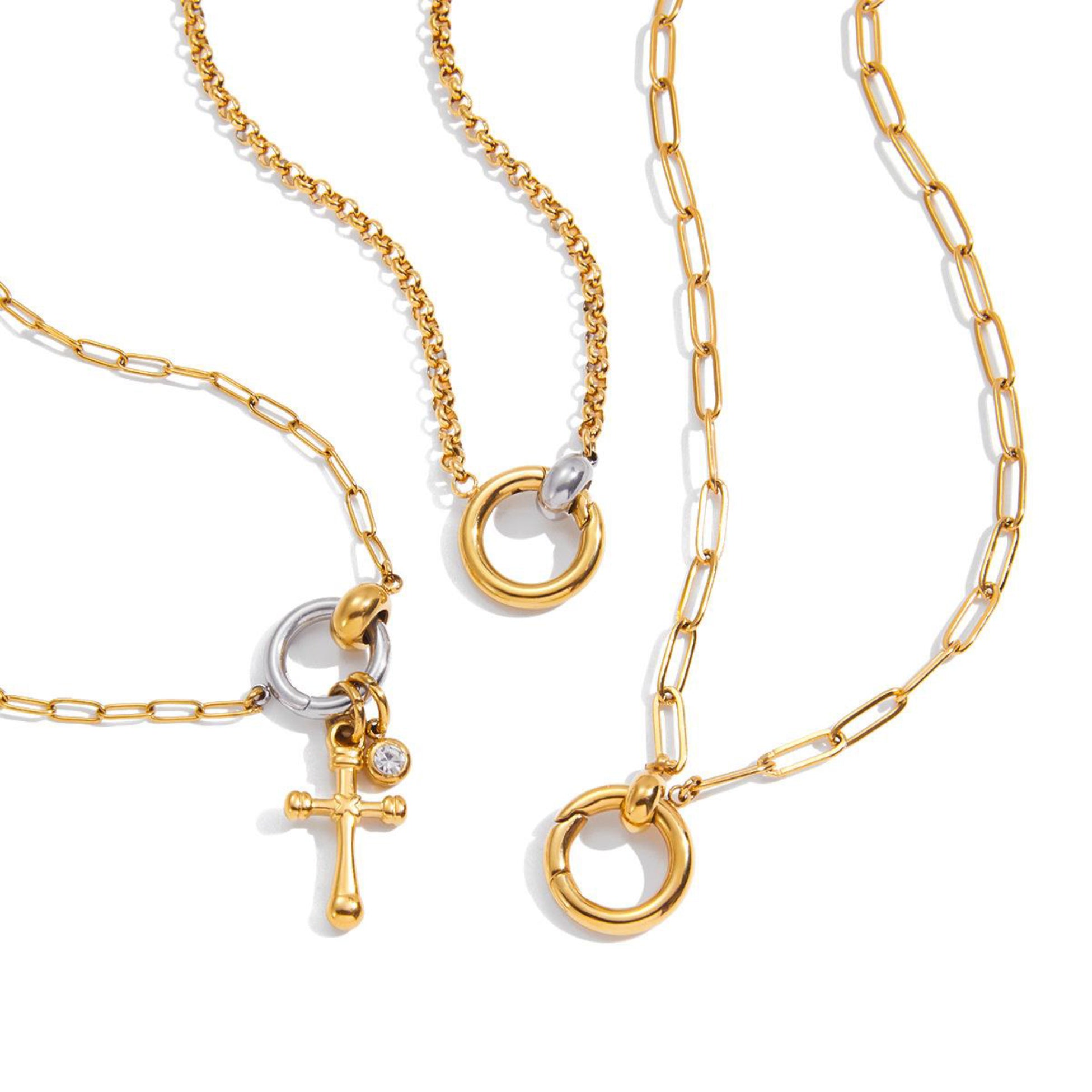 Gold necklaces with various pendants on a white background