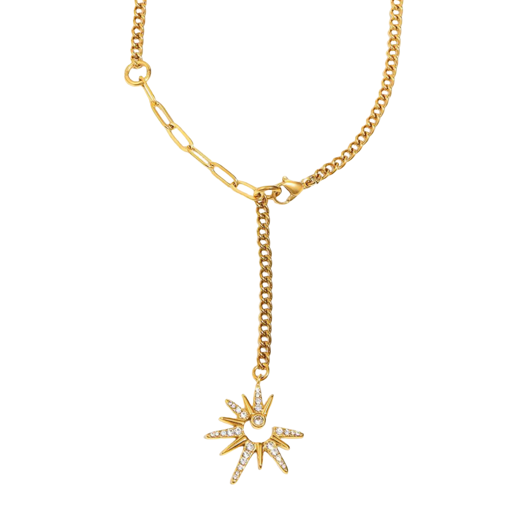 Gold necklace with a star-shaped pendant on a white background