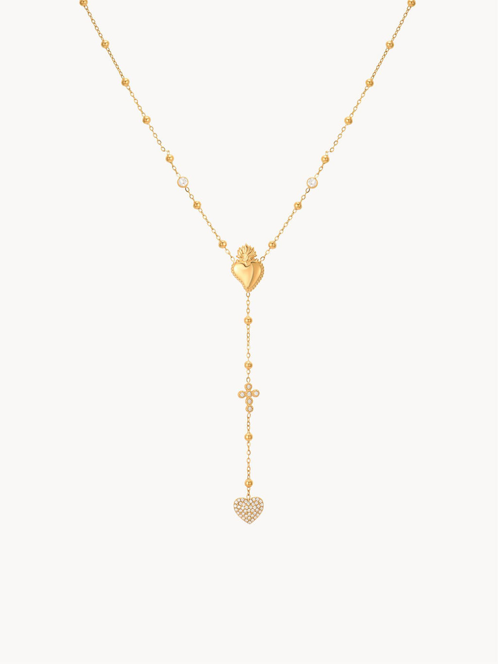 Gold necklace with heart-shaped pendants on a white background