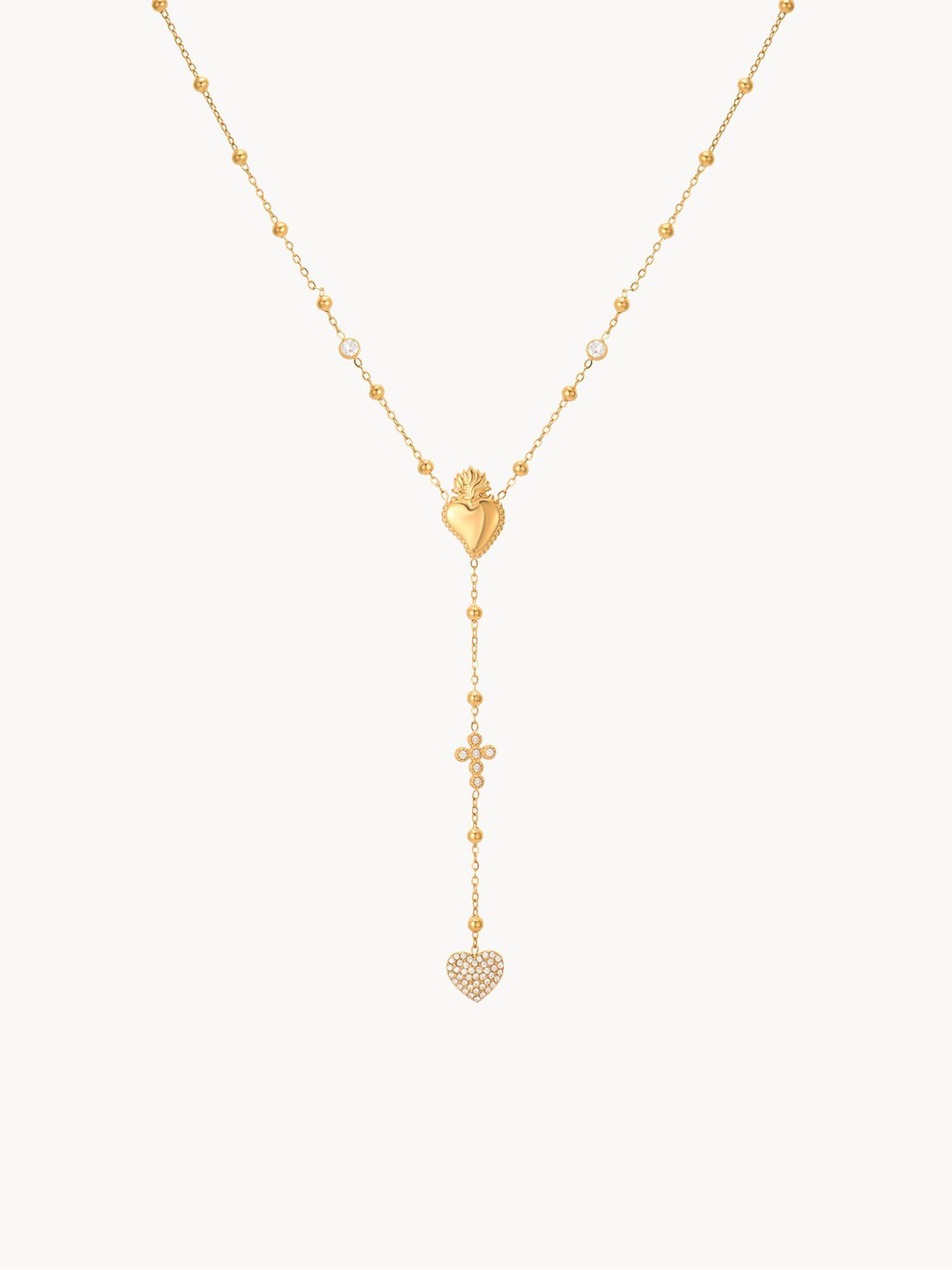 Gold necklace with heart-shaped pendants on a white background